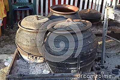 Four pots made of clay on the floor Stock Photo