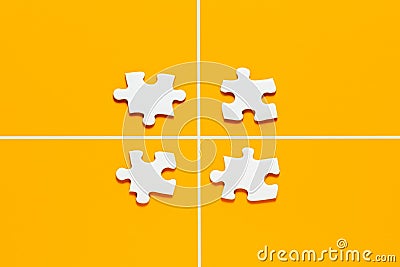 Four puzzle pieces separated from each other with lines. Family disintegration or lack of communication Stock Photo