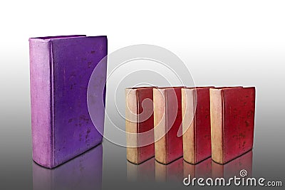 Four red cover books and big purple cover book Stock Photo