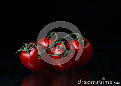 Four red tomatoes vegetables vegan food Stock Photo