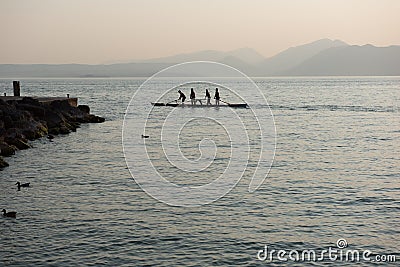 Four rowers rowing a boat standing Editorial Stock Photo