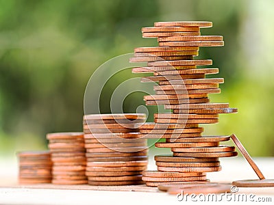 Four rows of rising growth golden stack coins with unstable stack different position at last row showing high growth high risk Stock Photo