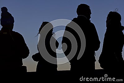 Four Silhouettes at Sunset Editorial Stock Photo
