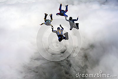 Four Skydivers building a star formation Stock Photo