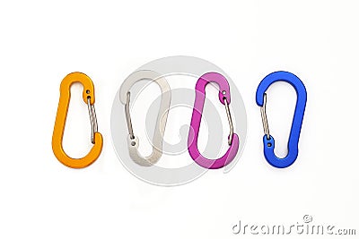 Four small wire gate carabiners not used for climbing, but for hanging accessories or keys. Colorful carabiners isolated on white Stock Photo