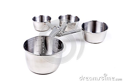 Four stainless steel measuring cups clipped together Stock Photo