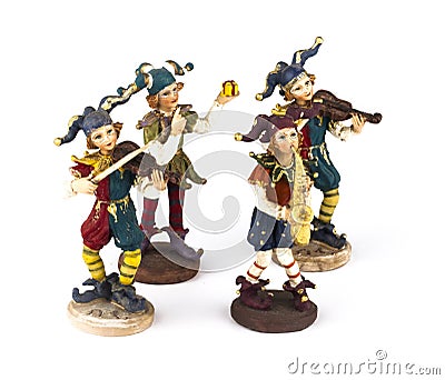 Four statuettes of masquerade musicians Stock Photo