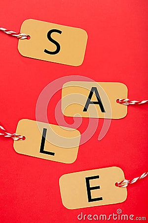 Four tags with the word sale on red background. Vertical foto Stock Photo