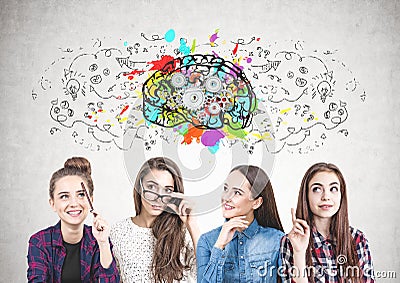 Four teen girls thinking together, cog brain Stock Photo