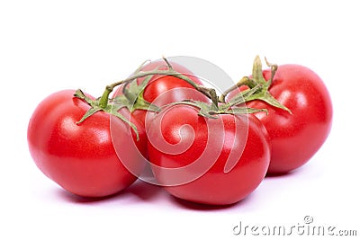 Four tomatoes on a branch Stock Photo