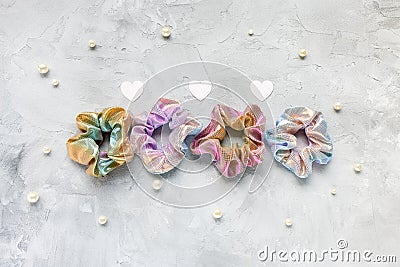 Four trendy velvet scrunchies, hearts and pearls Stock Photo