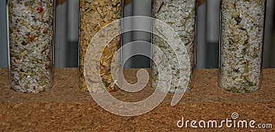 Four tubes with salts and herbs Stock Photo
