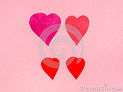 four various hearts cut from red papers on pink Stock Photo