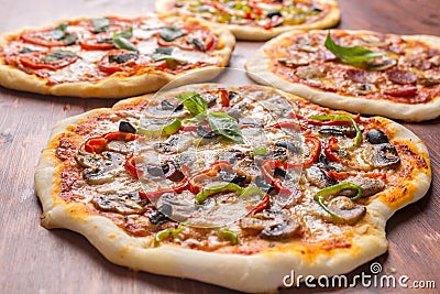 Four Various Pizzas Stock Photo