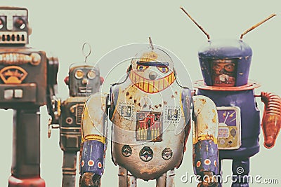 Four vintage rusted colorful tin toy robots Stock Photo