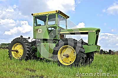 Four wheel drive John Deere tractor missing an engine Editorial Stock Photo