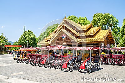 Four wheeled bicycle car rentals service provided for tourists in Yunnan Nationalities Village. Editorial Stock Photo