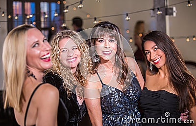 Four Women Smiling at a Party Stock Photo