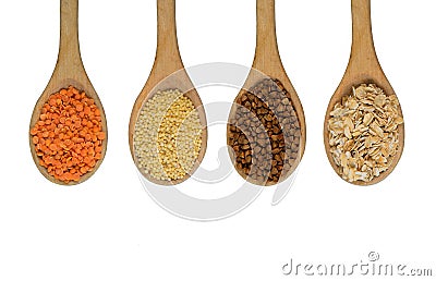 Four wooden spoons full of grains Stock Photo