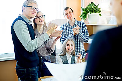 Four workers applauding Stock Photo