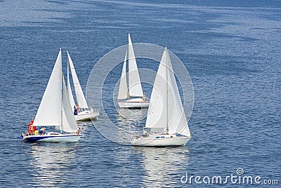 Four yachts making a close turn near buoy Stock Photo