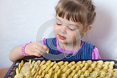 Four-year little girl preparing apple pie Stock Photo