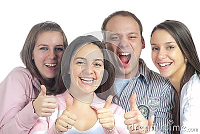 Four young people showing thumbs up Stock Photo