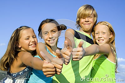 Four young positive kids Stock Photo