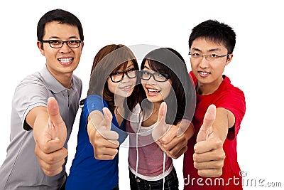 Four young teenagers and thumb up Stock Photo