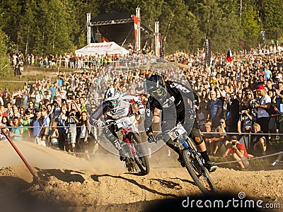 Fourcross biker race, fight on the race with people on background - editorial Editorial Stock Photo