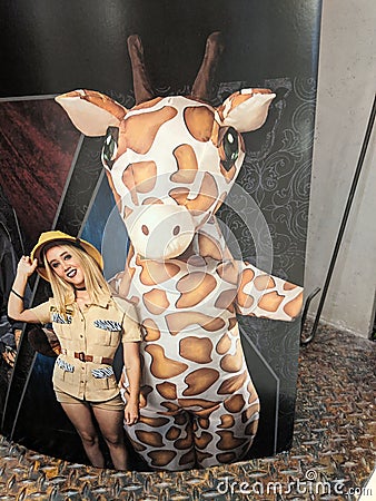 Giraffe and Zookeeper Halloween Costume Display Editorial Stock Photo