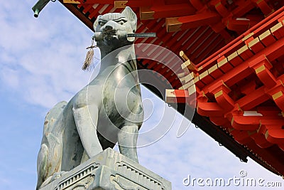 Fox sculture in Fushimi Inari Shrine in Kyoto, Japan Stock Photo