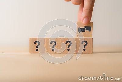 FQA, Q and A concept. Q and A symbols on wooden cube blocks on a grey background. Stock Photo