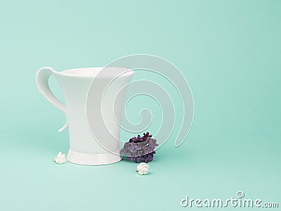 Fragile still life with lilacs and white Cup. Stock Photo