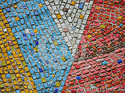 A fragment of an abstract mosaic ceramic panels on the wall. Multicolored stones. Stock Photo