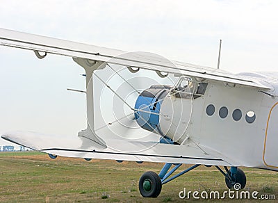 A fragment of an airplane AN2 with the engine running and the rotating screw. Stock Photo