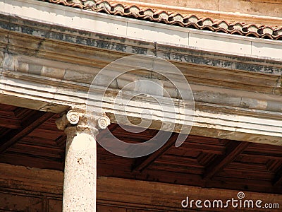 A fragment of an ancient building with an Ionian column Stock Photo