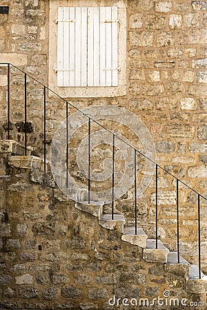 Fragment of an ancient building with a staircase in the old town of Budva Editorial Stock Photo