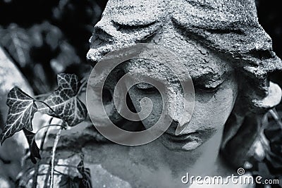 Fragment of ancient statue. Face of angel of death Stock Photo