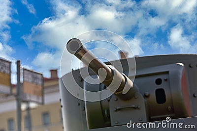A fragment of an armored vehicle against background of a blurred bus stop sign Stock Photo