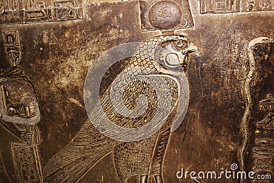 Fragment of a bas-relief with ancient god Horus in the temple of Hathor Egypt Stock Photo