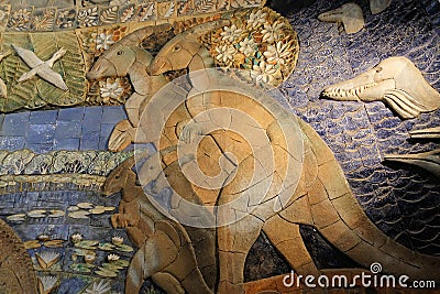 Fragment of a bas-relief with the image of dinosaurs in the Museum of Paleontology Moscow. - 2018 December 01 Editorial Stock Photo