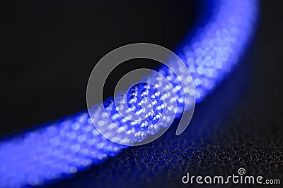 Fragment of a bead necklace with snake head lock on a dark background Stock Photo