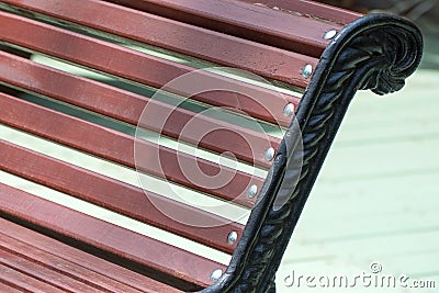 Fragment of a bench with carved legs in a city park Stock Photo