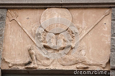 Fragment building decorated with frieze with two naked warriors Stock Photo