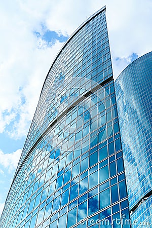 Fragment of contemporary architecture, walls made of glass and concrete. Glass curtain wall of modern office building Stock Photo