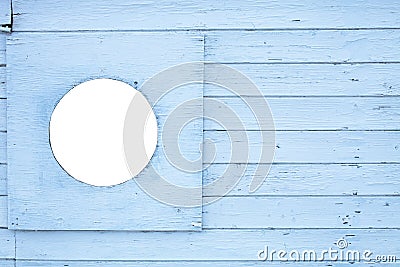 Fragment of a cyan paynted wooden surface with a round empty hole for the image. Toning Stock Photo