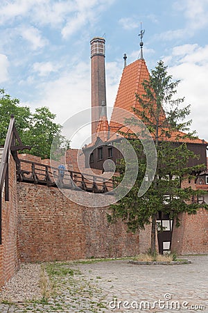 A fragment of the defensive walls with a tower built around 1285 using the opus emplectum technique. Opole, Poland, Europe Stock Photo