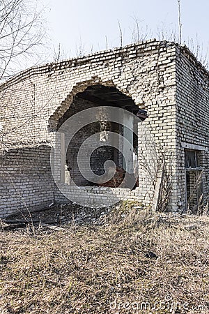 A fragment of the destroyed brick building Stock Photo