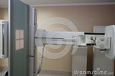 Fragment of a diagnostic X-ray apparatus in the work of the X-ray room. Stock Photo